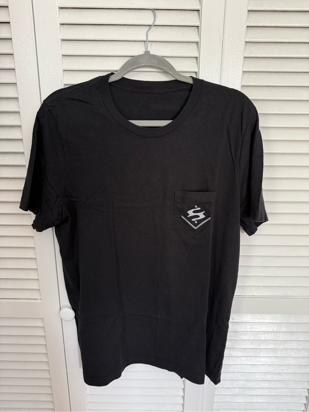 Men's Black Pocket Tee with Switchback Brewing Co logo